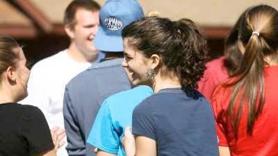 RPI student outside chatting with a friend