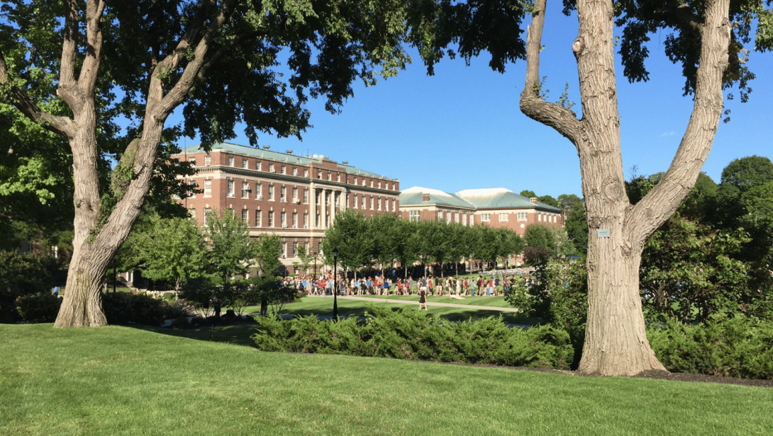 RPI Campus, green grass, with student in the far background